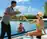 A couple are pleased with the best gourmet drink selection available by the pool in Kanifushi island resort